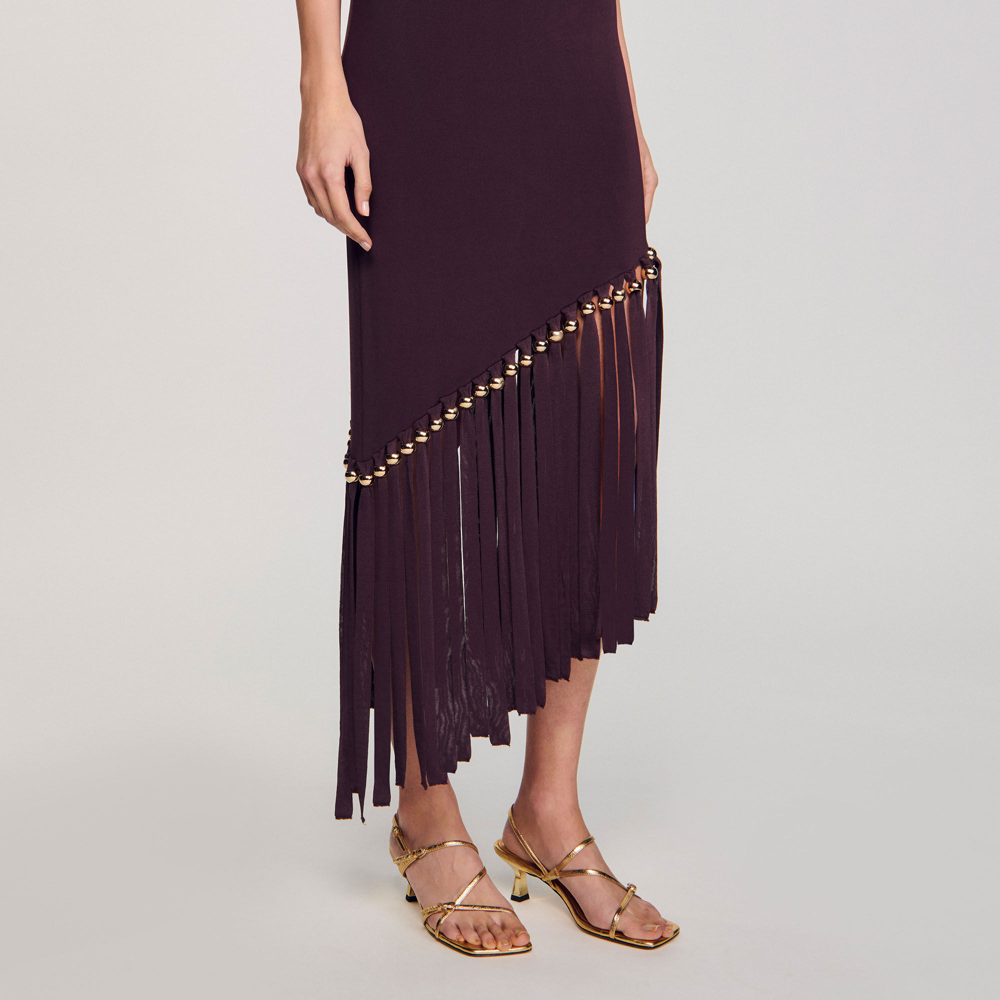 Robe longue frangée et perlée