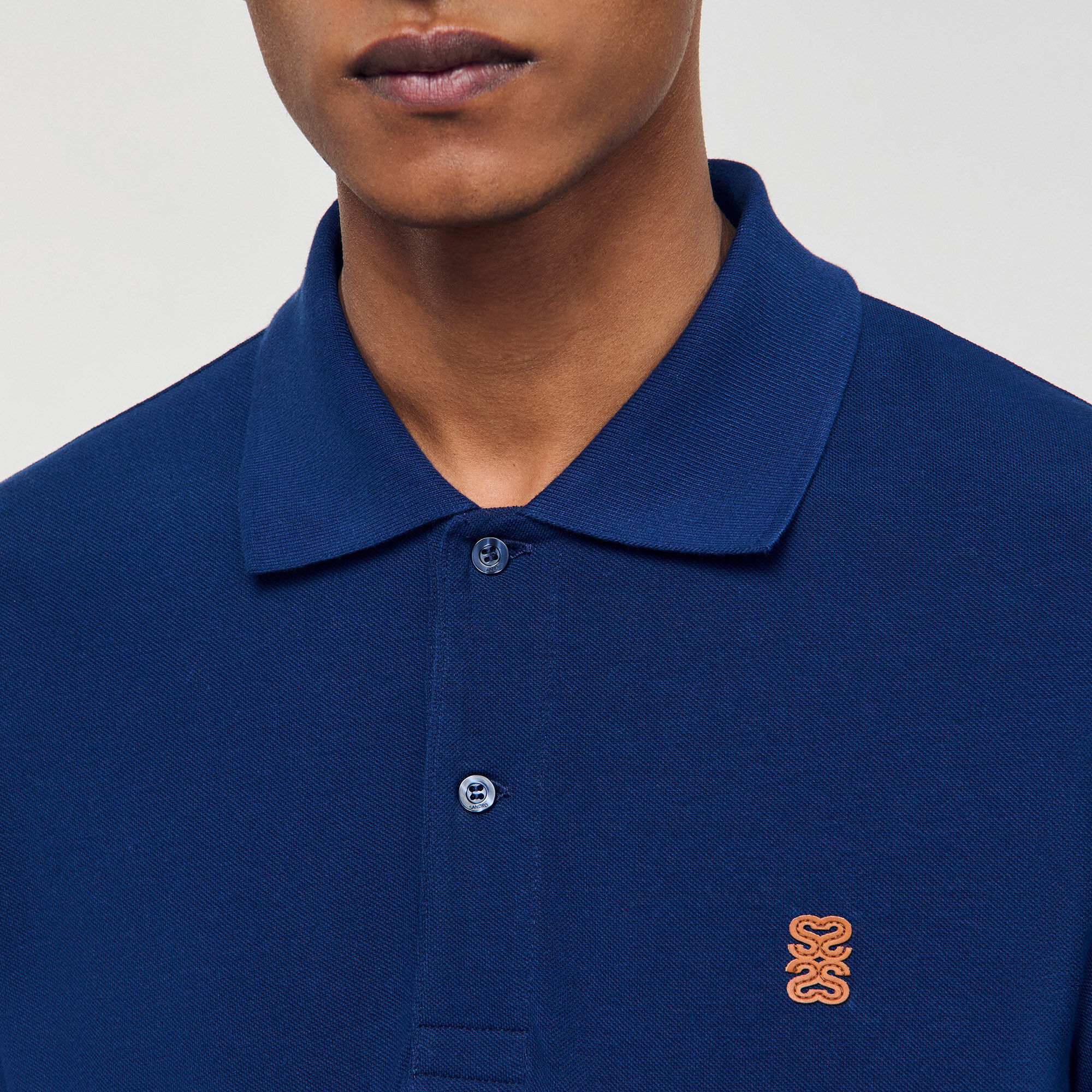 Polo à logo cuir
