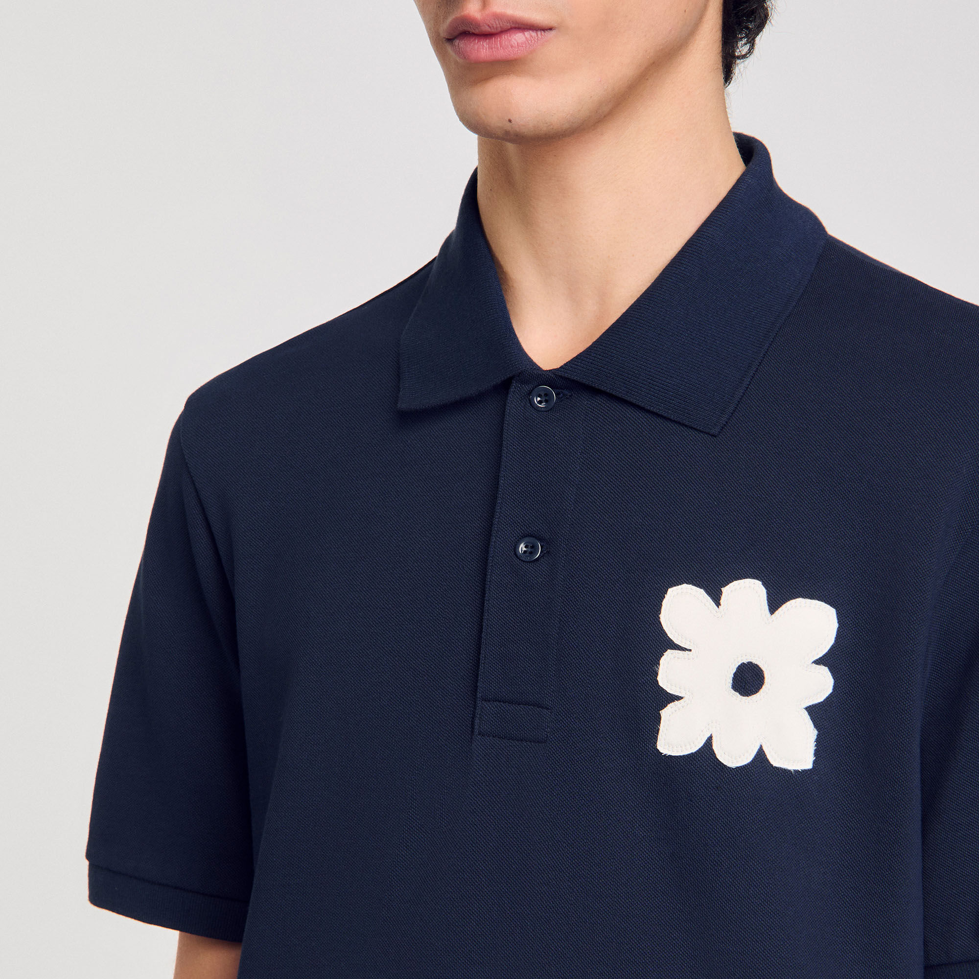 Polo à patch fleur